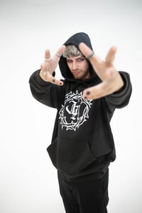 Image 4 of 'The Original' Hoodie in Black with White 'JA' Logo.