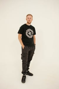 Image 1 of 'The Original' T-Shirt in Black with White 'JA' Logo.