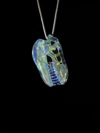 Image 3 of Fully cfl reactive T-Rex skull pendant. 