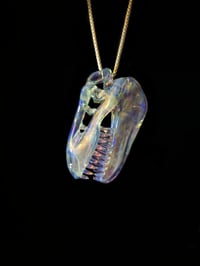 Image 4 of Fully cfl reactive T-Rex skull pendant. 