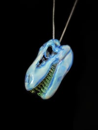 Image 1 of Mirage (CFL reactive) T-Rex skull pendant with illuminati teeth (UV)