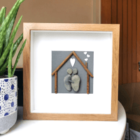 Image 1 of Couple under little house artwork