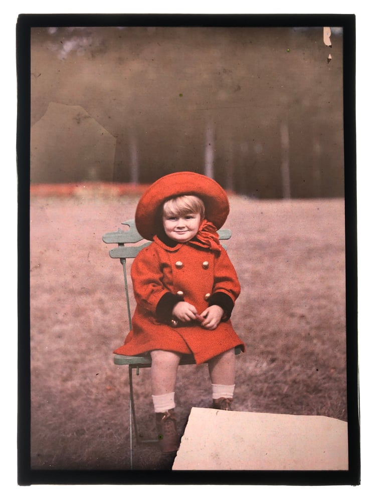 Image of Anonymous: autochrome portrait of child with red coat, ca. 1925
