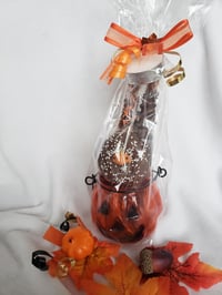 Pumpkin tea light filled with fall treats
