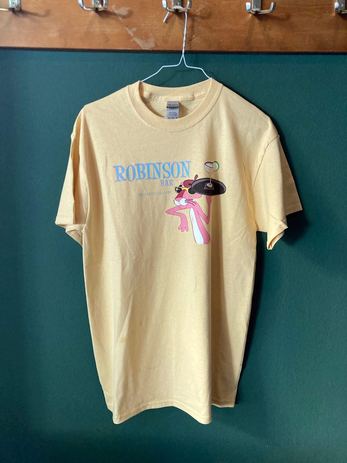 Image of Robinson Bar "Need a drink?" Paul P T-Shirt (dirty yellow)