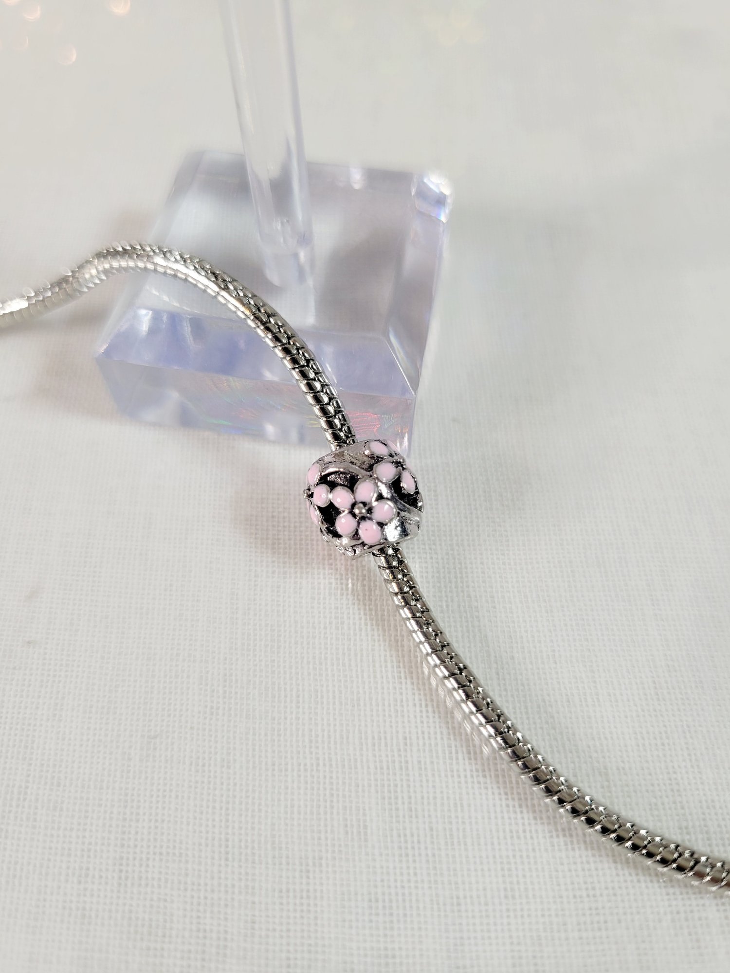 Image of Round Hollow Pink Flowers Charm