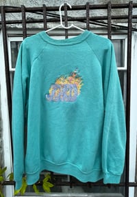 Image 1 of JOYCO over teal