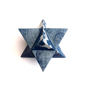 Image of Archival photographic print of two tetrahedrons in navy and silver