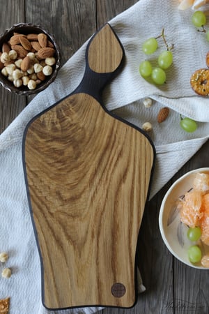 Image of Ebonized oak serving board with leaf shape handle