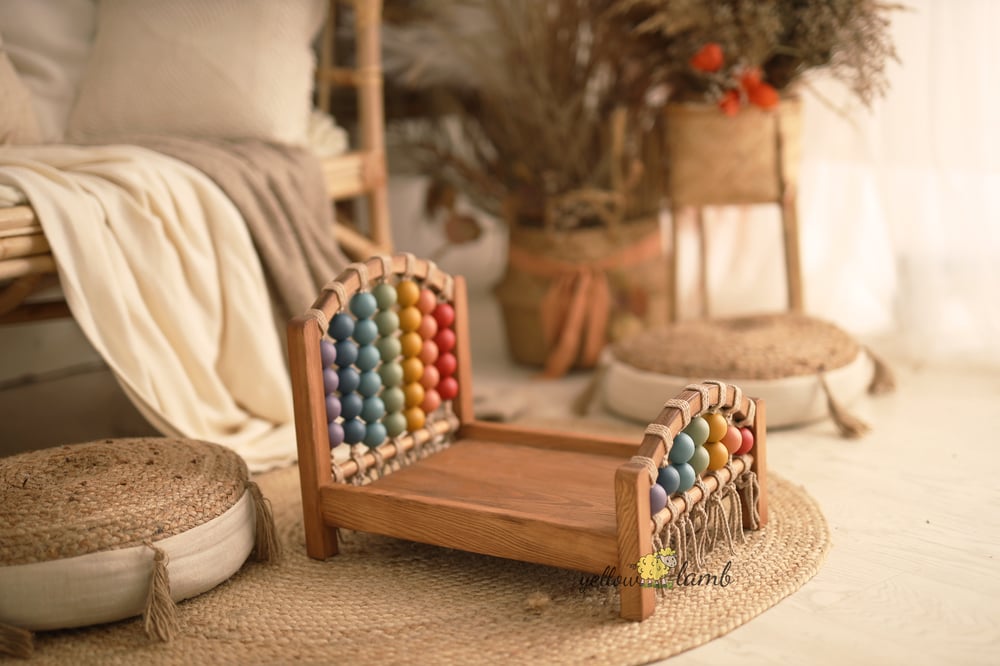 Image of « rainbow bed NB up to sitter with whiskey brown frame  »