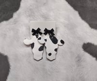 Image 2 of Black and White Cow Clay Bow Earrings