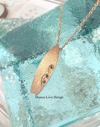 Image 1 of 14k solid gold surf board with Hawaiian waves blue diamond 