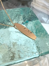 Image 2 of 14k solid gold surf board with Hawaiian waves blue diamond 