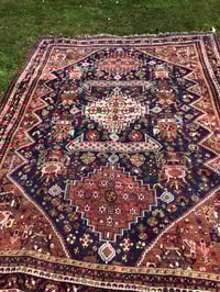 Antique hand knotted oriental rug with red and blue body 