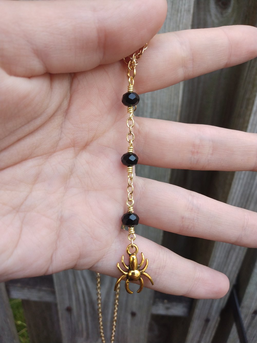 Lariat style black & gold spider necklace 