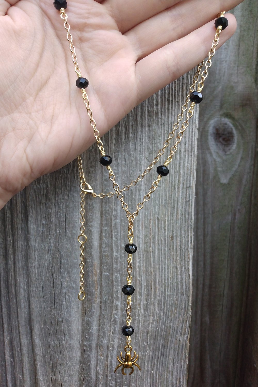 Lariat style black & gold spider necklace 