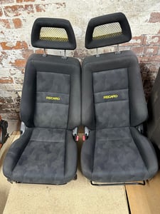 Image of Genuine Recaro Sports Seats Black Cloth with Yellow Fishnet Headrests
