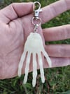 Glow in the dark skelly hand keychain