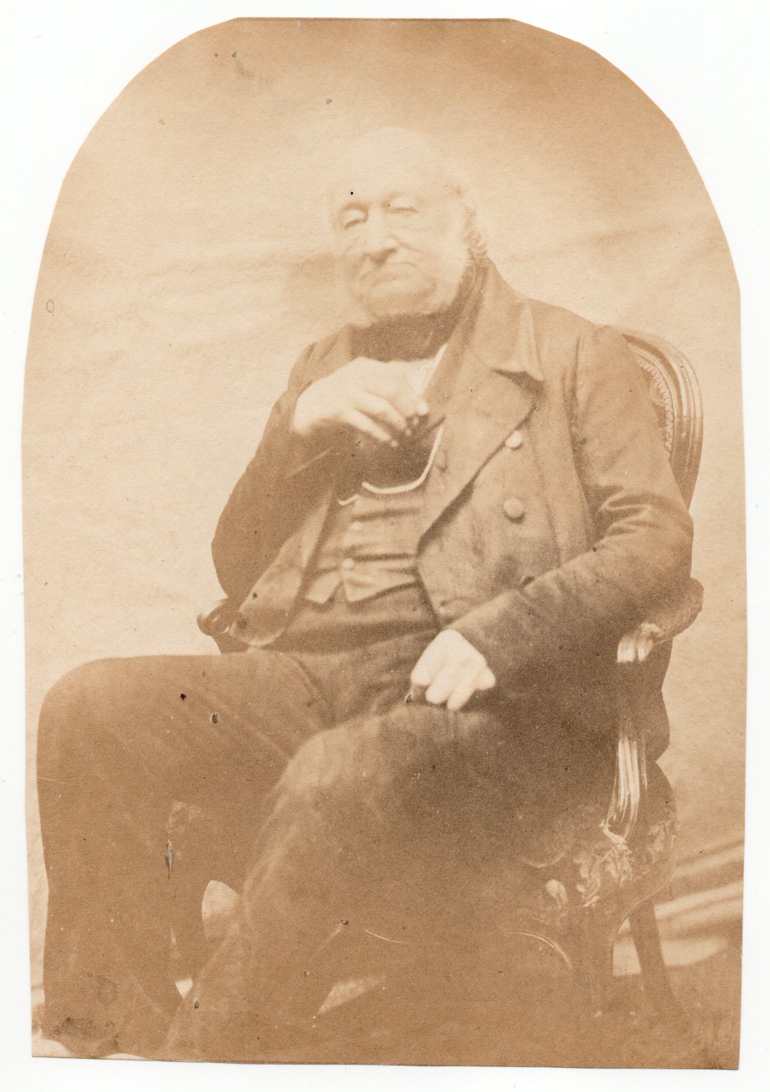 Image of Anonymous: man sitting near backdrop, UK ca. 1855