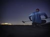 "Geco in Athens, roll-down action at night"