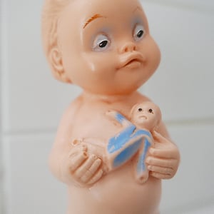 Image of Rolly-Toys_Squeaker Rubber Doll