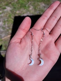 Image 3 of Opal crescent moon earrings.