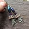 Image of Purple And Copper Skeleton Embrace Crystal Beaded Earrings