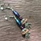 Image of Purple And Copper Skeleton Embrace Crystal Beaded Earrings