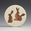 Three Hares ceramic wall hanging 