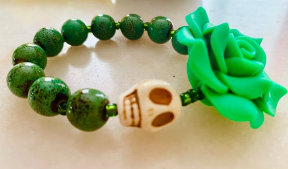 Image of Howlite carved Skull with lamp work beads