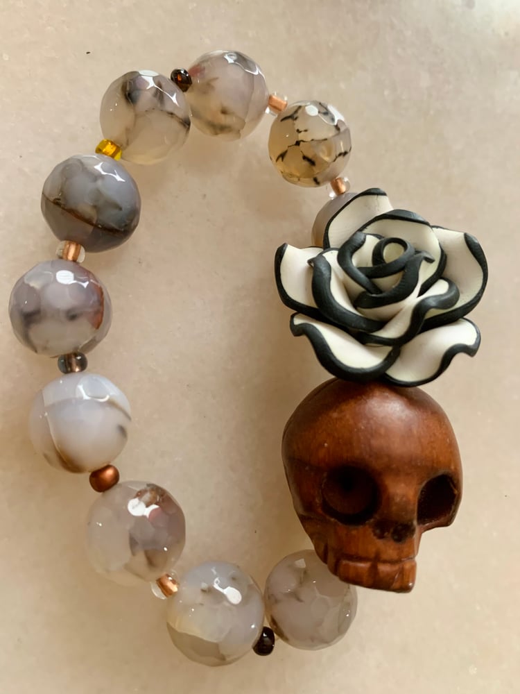 Image of Wood carved Skull with Flower Agate
