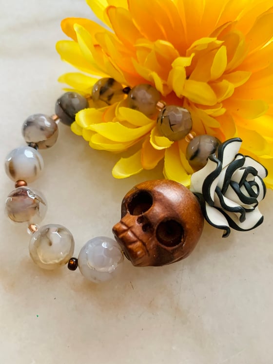 Image of Wood carved Skull with Flower Agate