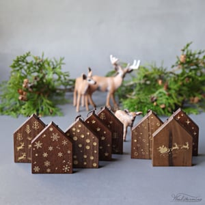 Image of Elegant hanging wooden houses Christmas ornaments with festive gold color patterns, set of 8