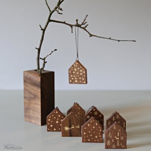 Image of Elegant hanging wooden houses Christmas ornaments with festive gold color patterns, set of 8
