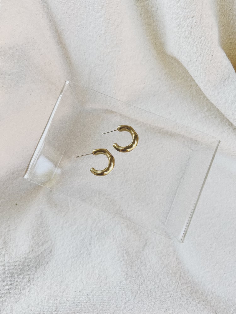 Image of organic shaped brass small hoops