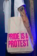 PRIDE IS A PROTEST Tote bag (White, pink print and navy handle)