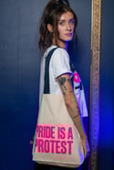 PRIDE IS A PROTEST Tote bag (White, pink print and navy handle)