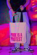 PRIDE IS A PROTEST Tote bag (White, pink print and navy handle)