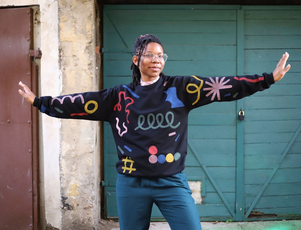 Image of PAINTED BLACK UNISEX SWEATSHIRT