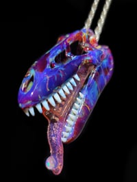 Image 1 of Amber purple T-Rex skull pendant with an L.S.D. joint tip 🦖💀💨👅