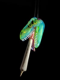 Image 3 of Titan v1 T-Rex skull pendant with a dosed L.S.D. tongue joint tip 🦖💀💨👅