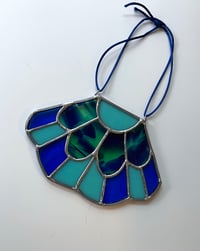 Image 1 of Fan sun catcher in peacock