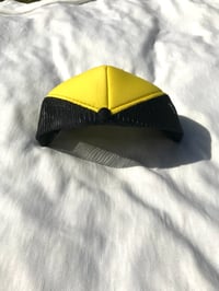 Image of like a beehive trucker hat in black/yellow