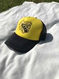 Image of like a beehive trucker hat in black/yellow