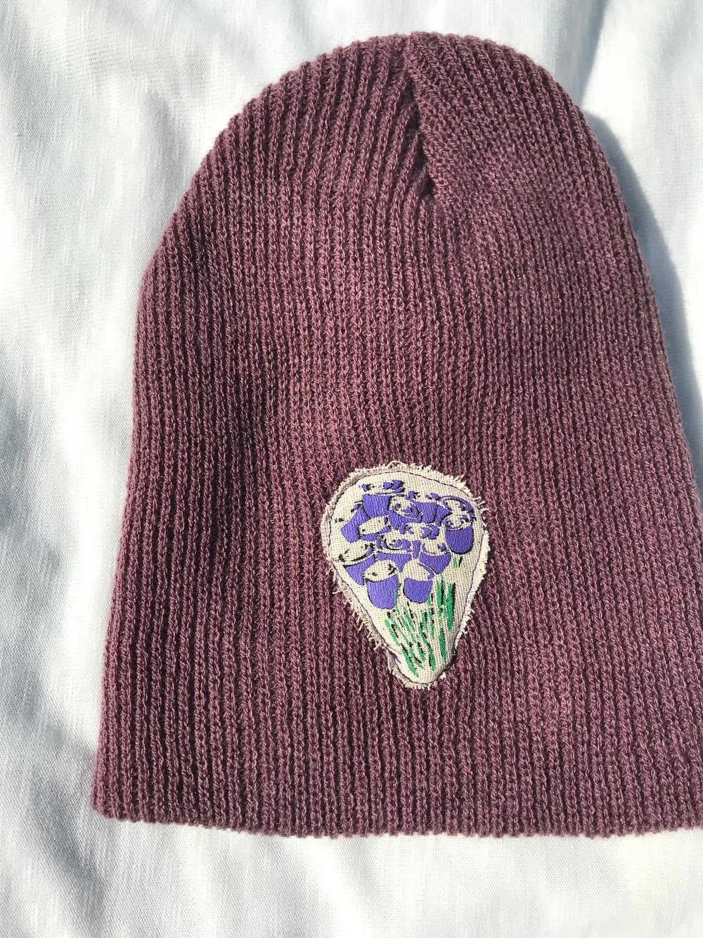 give me my fucking flowers beanie in purple 