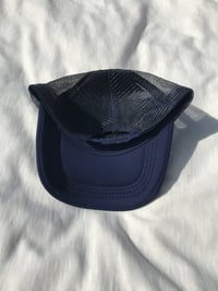 Image of the stop being scared trucker cap in navy blue