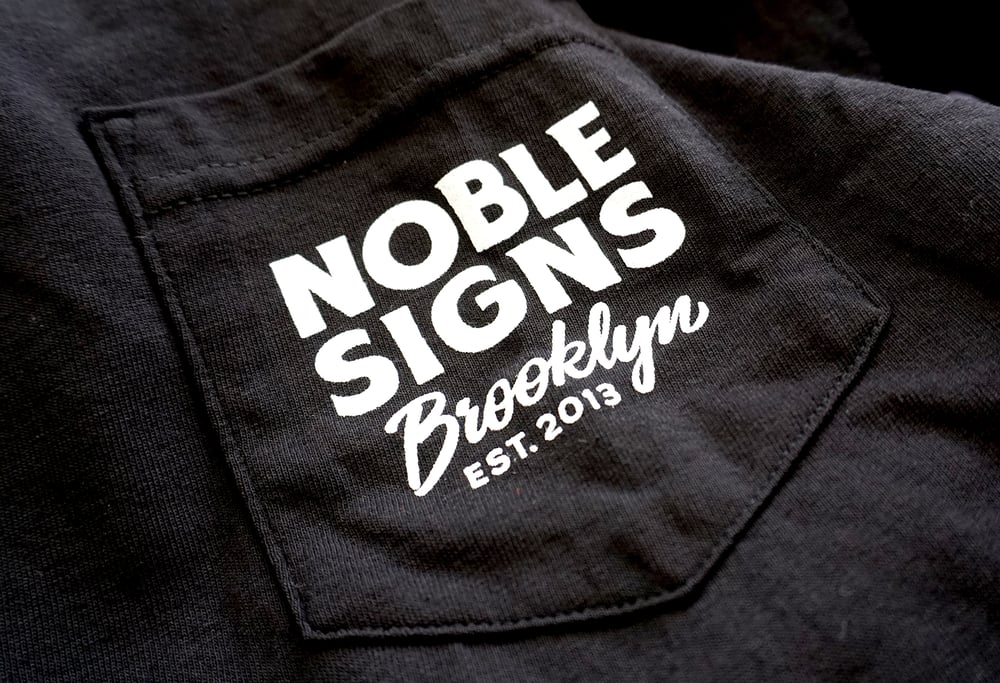 Noble Signs Official “Shop” T-Shirt (Black)