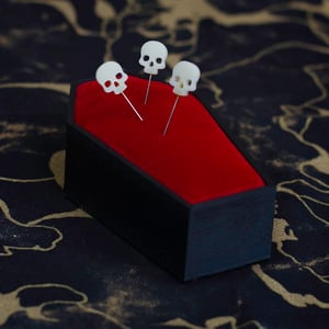 Image of Deadly Notions Coffin Pincushion with skull head pins