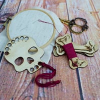 Image 1 of Deadly Notions Skull and Bones Floss Set