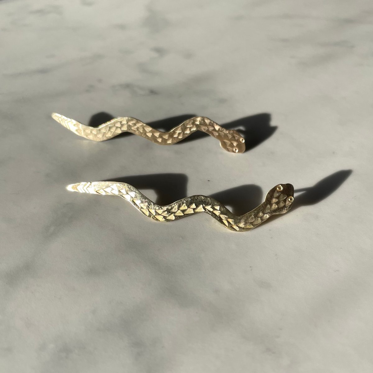 Image of brass serpent earring 